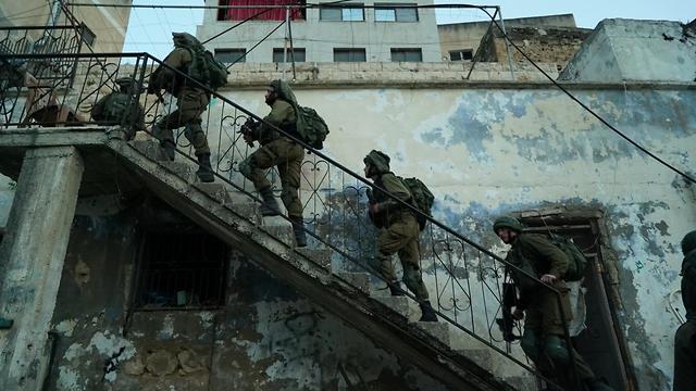 IDF troops hunting for the killer of First Sgt. Amit Ben Yigal in the West Bank 