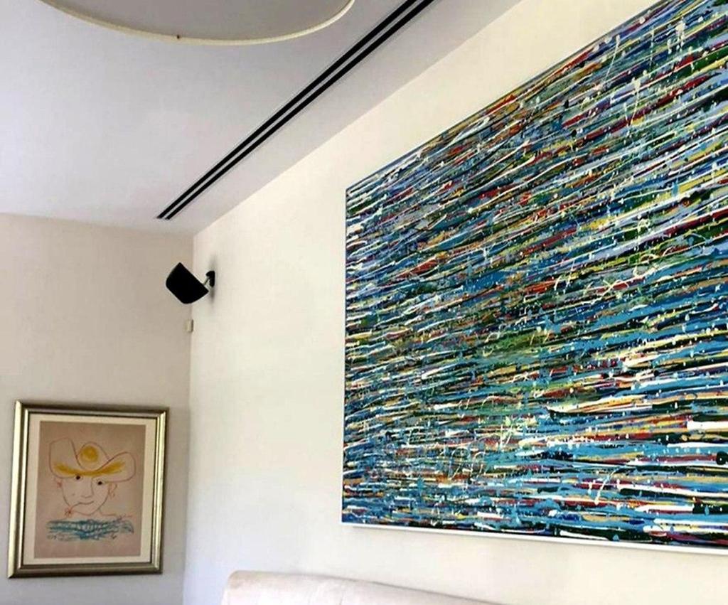 A work by Iris Eshet Cohen hangs near a Piccaso (Photo: Courtesy of Iris Eshet Cohen) A work by Iris Eshet Cohen hangs near a Piccaso