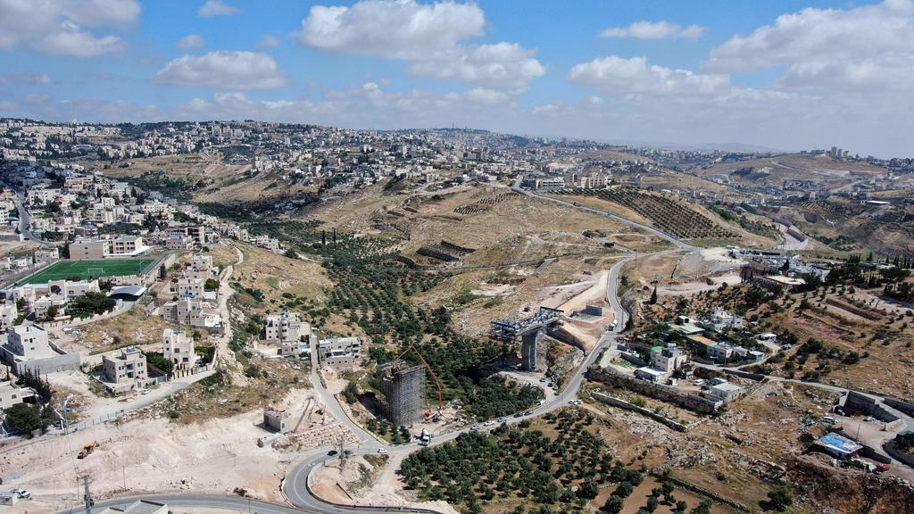 An aerial view shows a section of The American Road, an Israeli ring road being built near the Palestinian neighbourhood of Umm Tuba in East Jerusalem (Photo: Reuters) An aerial view shows a section of The American Road, an Israeli ring road being built near the Palestinian neighbourhood of Umm Tuba in East Jerusalem