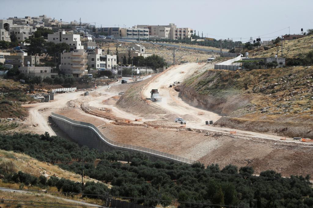 An aerial view shows a section of The American Road, an Israeli ring road being built near the Palestinian neighbourhood of Umm Tuba in East Jerusalem 
