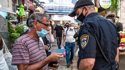 Jerusalem police enforce health directives to fight the spread of coronavirus 