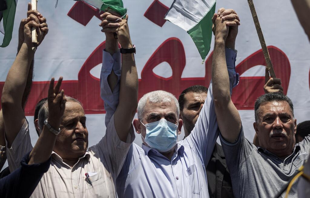 Hamas leader in the Gaza Strip, Yahya Sinwar, center, attends a demonstration against Israeli plans for the annexation of parts of the West Bank, in Gaza City, July 1, 2020 