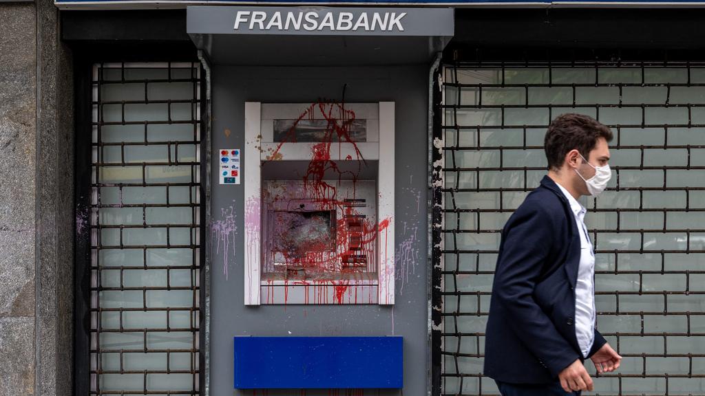 Man walks by defaced cash point during Lebanon's economic crisis (Photo: ABACA) Lebanon, as seen on July 13, 2020, as major economical and political crisis hits Lebanon, may be the worst since the end of civil war in 1990
