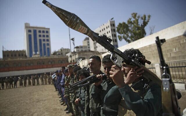 Houthi rebel fighters display their weapons during a gathering aimed at mobilizing more fighters for the Iranian-backed Houthi movement, in Sanaa, Yemen 
