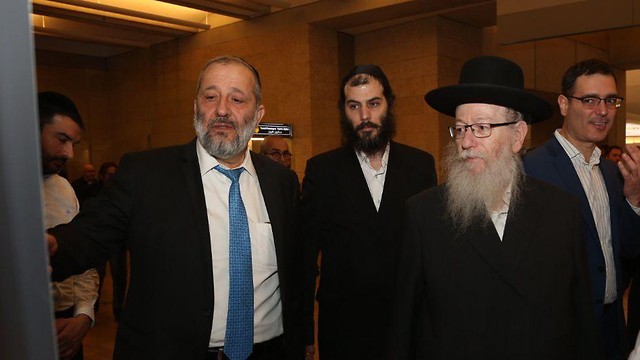 Interior Minister Aryeh Deri and Construction and Housing Minister Yaakov Litzman 