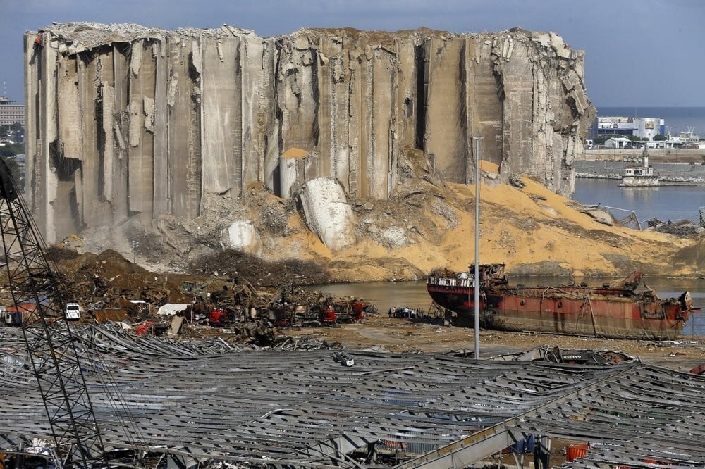 Rescue workers search for victims at the site of the explosion at Beirut seaport in August (Photo: AP) Earth moving equipment and rescue workers search for victims in Beirut, Lebanon, near the site of last week's explosion that hit the city's seaport