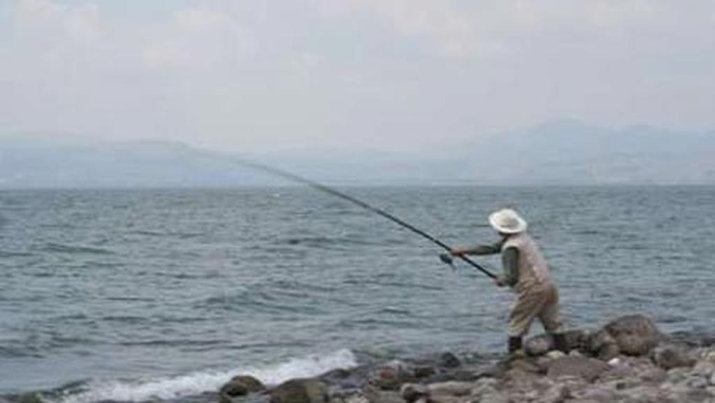 A recreational fisherman at the Sea of Galilee 