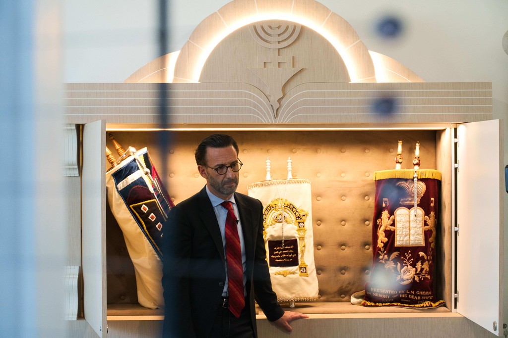 Ross Kriel, the president of the Jewish Council of the Emirates, in front of the community's Torahs in Dubai, Aug. 16, 2020