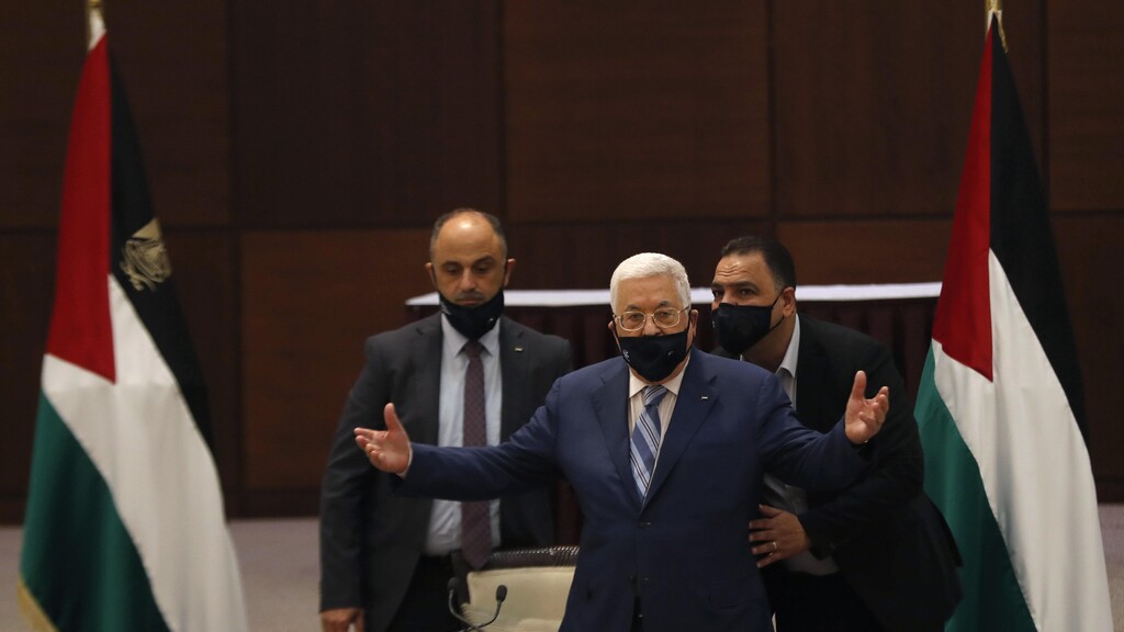 President Mahmoud Abbas gestures during a meeting with the Palestinian leadership to discuss the United Arab Emirates' deal with Israel to normalize relations,