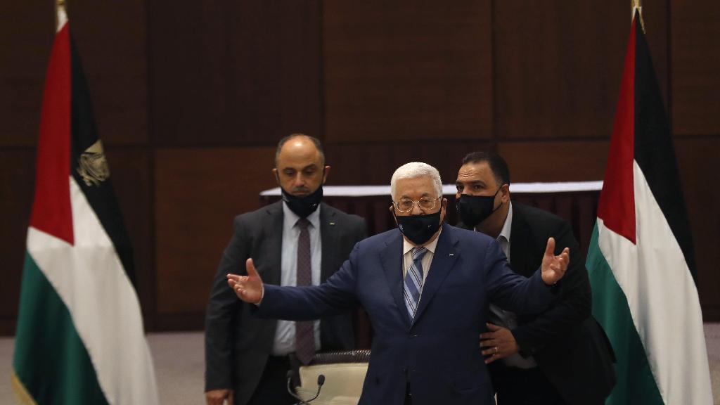 President Mahmoud Abbas gestures during a meeting with the Palestinian leadership to discuss the United Arab Emirates' deal with Israel to normalize relations,