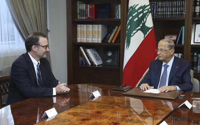 Lebanese President Michel Aoun, right, meets with David Schenker, Assistant Secretary of State for Near Eastern Affairs, at the presidential palace, in Baabda east of Beirut, Lebanon 