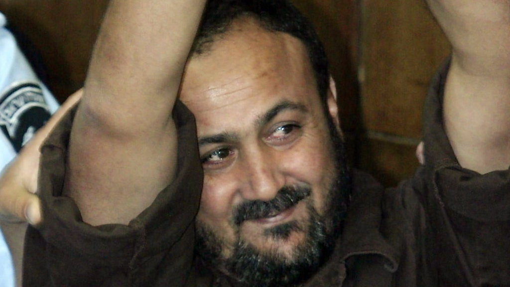 Marwan Barghouti, serving five life sentences in Israeli jail, who is challenging Abbas for the leadership of the PA (Photo: EPA) ברגותי בבית המשפט הישראלי
