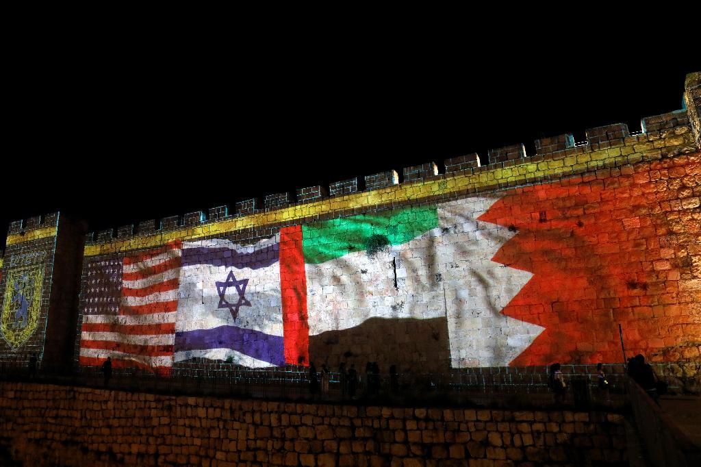 The flags of the United States, Israel, United Arab Emirates and Bahrain are projected on a section of the walls surrounding Jerusalem's Old City
