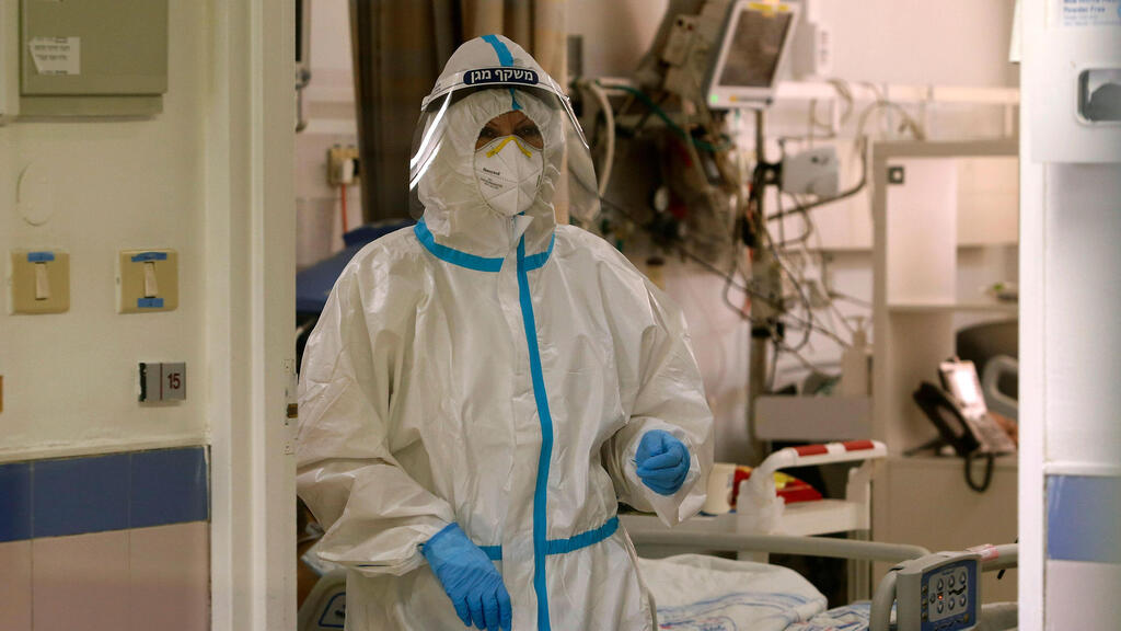  A healthcare professional wears protective gear on the coronavirus ward at Barzilai Medical Center in Ashkelon 