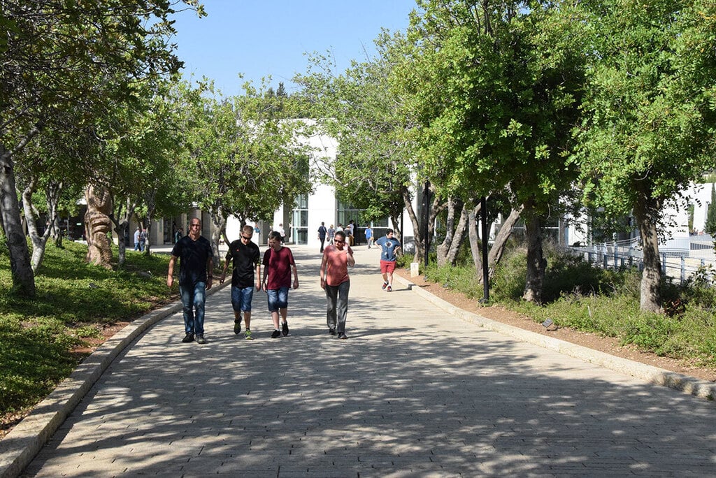 Visitors walking through the Garden of the Righteous in Yad Vashem, honoring those of saved Jews from the Nazis during WWII (Photo: Yad Vashem) שדרת חסידי אומות עולם ביד ושם