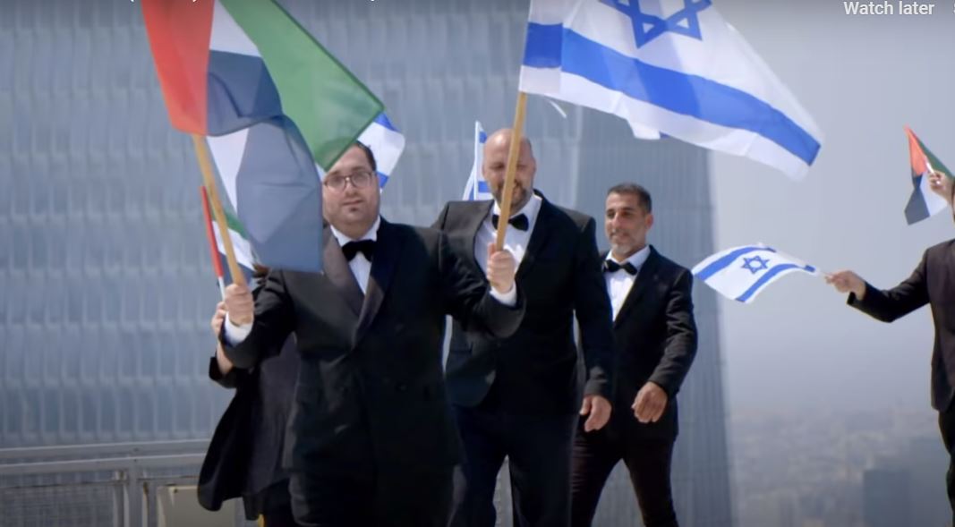 The Firqat Alnoor Orchestra carries israeli and Emirati flags in a musical tribute to new bilateral ties 