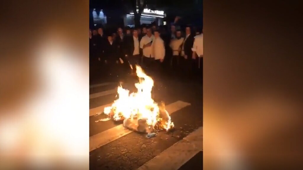 Footage shows Haredim allegedly burn face masks Footage shows Haredim allegedly burn face masks