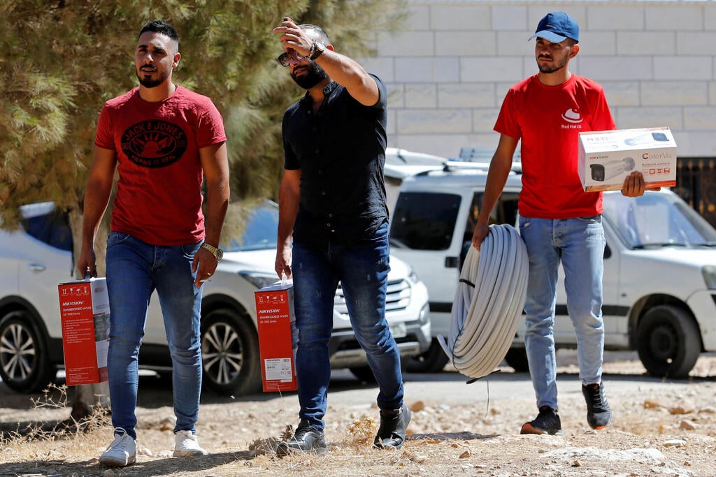 Workers arrive to install a video surveillance in the Palestinian village of Kisan (Photo: Reuters) Workers arrive to install a video surveillance system to keep an eye on nearby Israeli settlers who Palestinians accuse of frequent attacks, in the village of Kisan in the Israeli-occupied West Bank