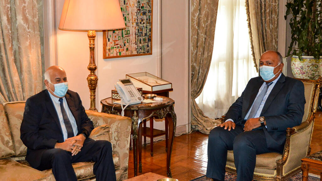 Egyptian Ministry of Foreign Affairs on September 28, 2020 shows Foreign Minister Sameh Shoukry (R) meeting with Jibril Rajoub
