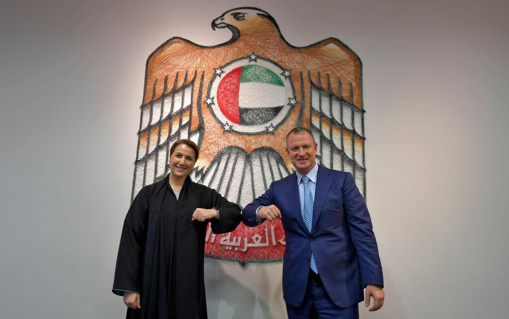 Emirati Minister of State for Food and Water Security Mariam al-Muhairi (L) and Erel Margalit