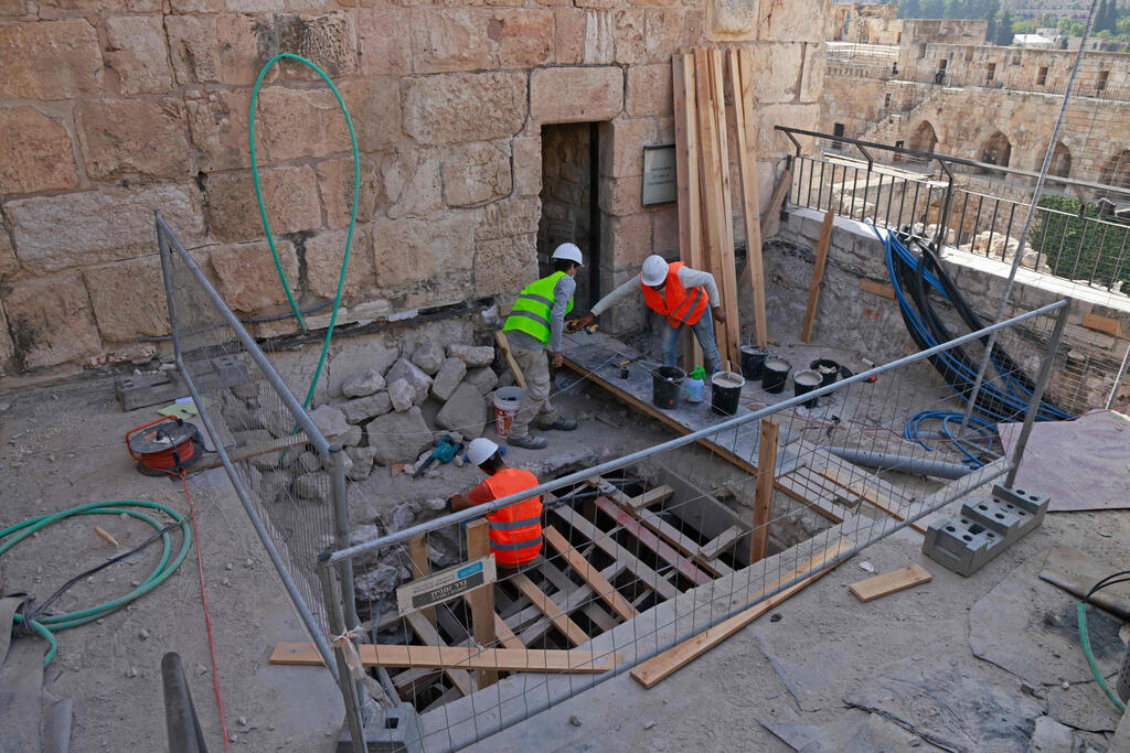 Workers renovate the Tower of David Museum near the Jaffa Gate entrance to the Old City of Jerusalem, Oct. 28, 2020 