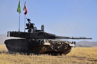 An Iranian tank flying the national and Revolutionary Guards Corps flags 