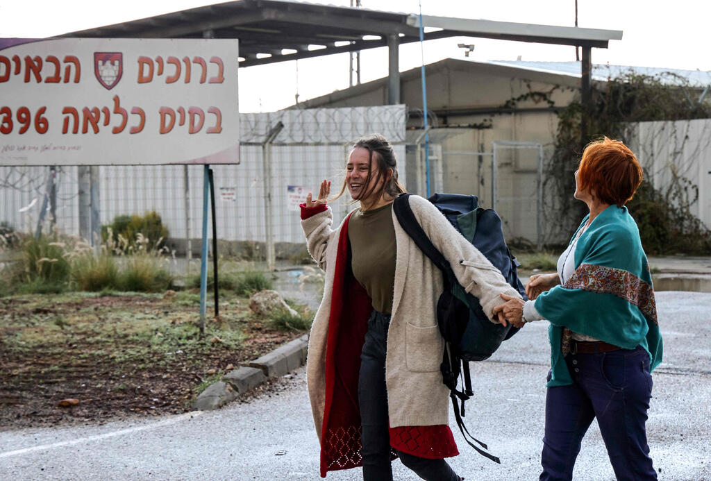 Hallel Rabin (L), a 19-year-old Israeli conscientious objector, walks with her mother Irit Rabin outside the "number six" military prison near Atlit in northern Israel 