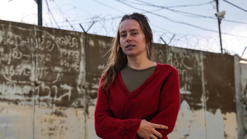 Hallel Rabin, a 19-year-old Israeli conscientious objector, poses for a picture outside the "number six" military prison near Atlit in northern Israel 