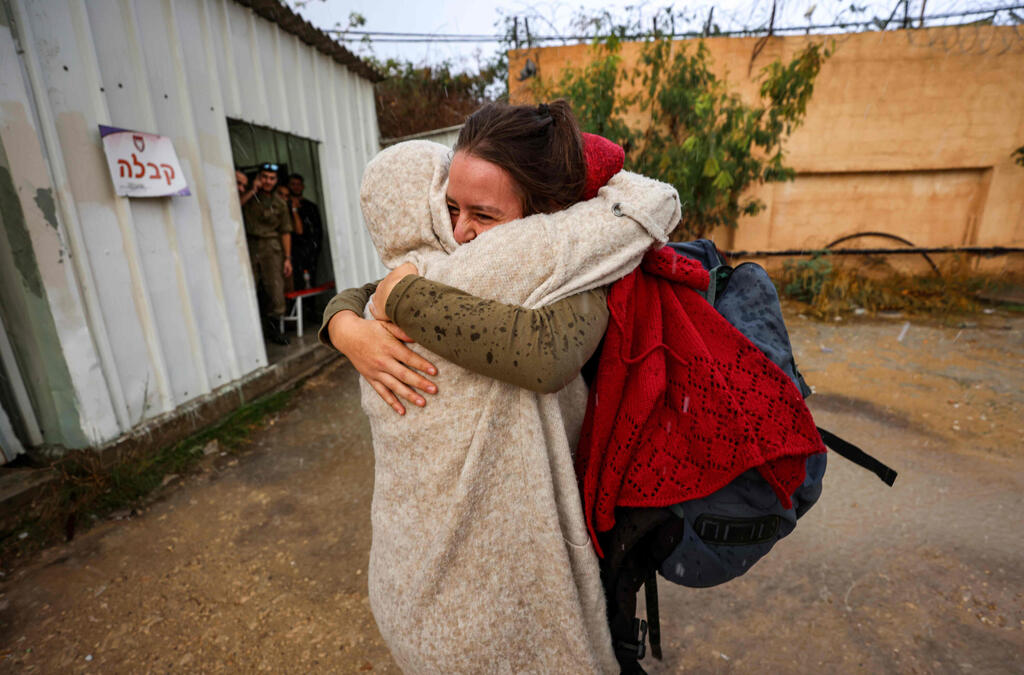 Hallel Rabin (behind), a 19-year-old Israeli conscientious objector, embraces her mother Irit Rabin outside the "number six" military prison near Atlit in northern Israel 