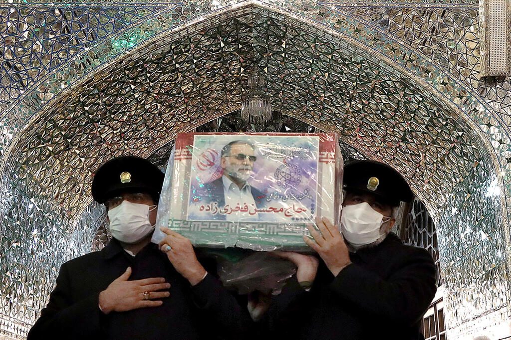 Servants of the holy shrine of Imam Reza carry the coffin of Iranian nuclear scientist Mohsen Fakhrizadeh, in Mashhad, Iran 