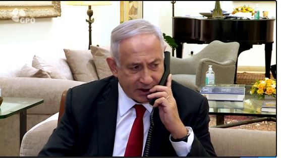 Prime Minister Benjamin Netanyahu speaking to Jonathan Pollard after restrictions on his parole restrictions were lifted in November 