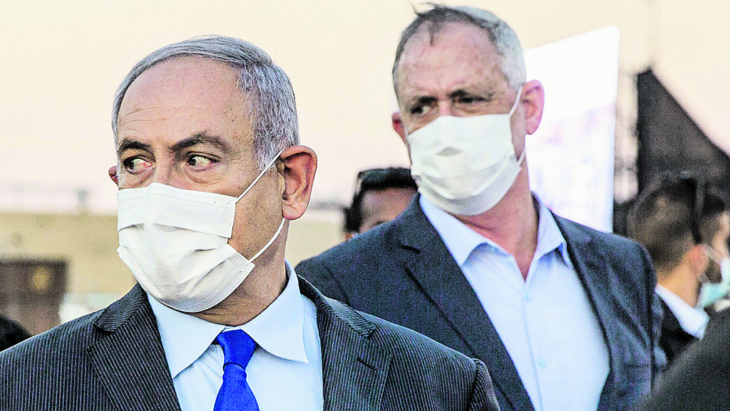 בישראל ימנעו את קיום הבחירות במזרח ירושלים? נתניהו וגנץ (צילום: AFP) בני גנץ עם בנימין נתניהו