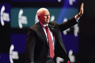 Vice President Mike Pence waves as he walks off the stage after speaking at the Turning Point USA Student Action Summit, Tuesday, Dec. 22, 2020, in West Palm Beach, Fla. 