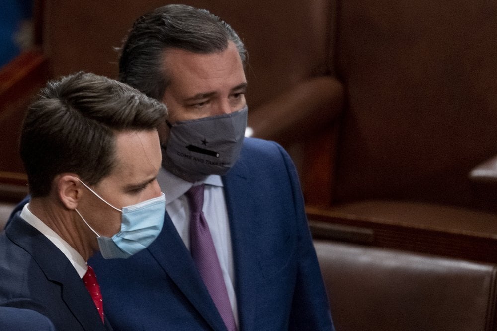 Sen. Josh Hawley, R-Mo., left, and Sen. Ted Cruz, R-Texas, right, speak after Republicans objected to certifying the Electoral College votes from Arizona, during a joint session of the House and Senate to confirm the electoral votes cast in November's election, at the Capitol, 