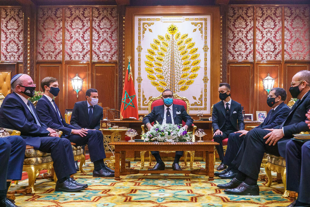 King Mohammed VI (C), flanked by his son Crown Prince Moulay Hassan (C R), meets with US Presidential advisor Jared Kushner (2nd L) and Israeli National Security Advisor Meir Ben Shabbat (L) at the Royal Palace in Rabat