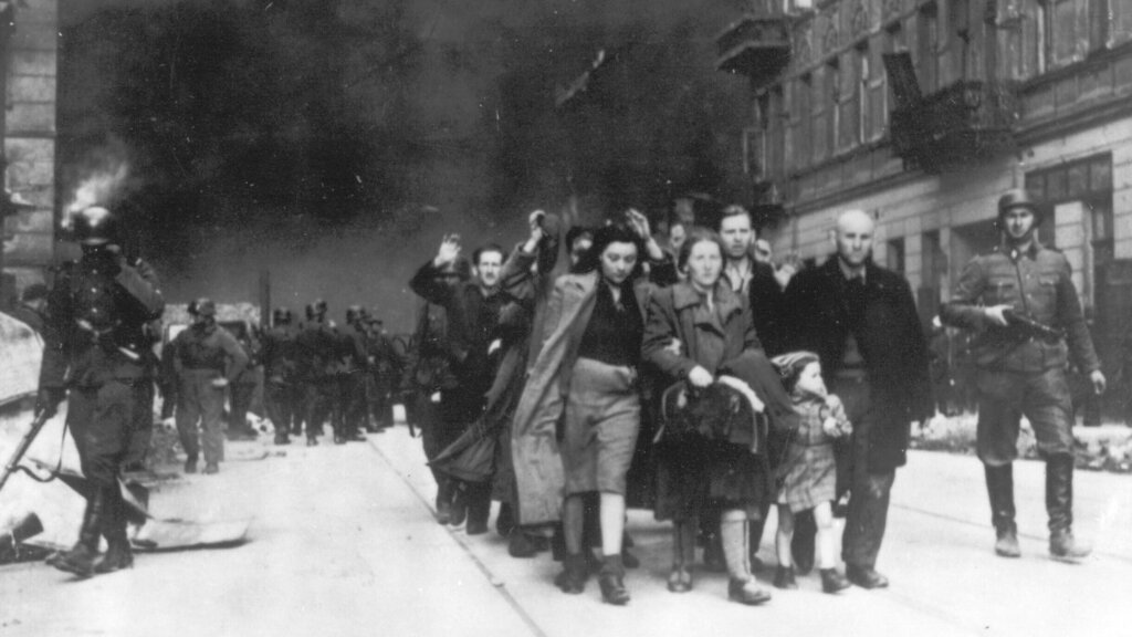 A group of Polish Jews are led to deportation by German SS troops