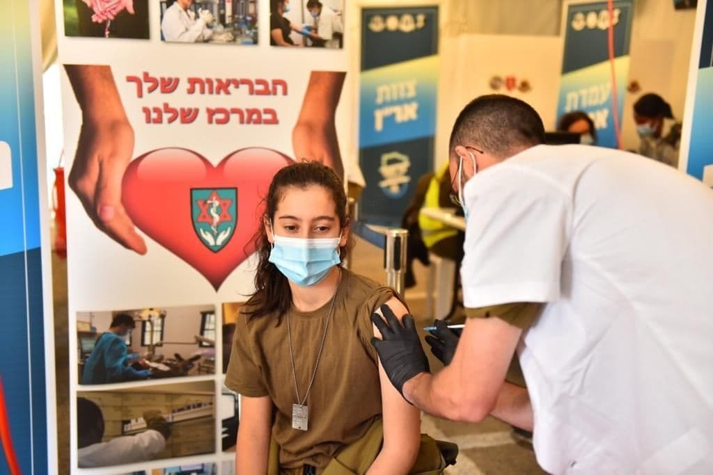 An IDF soldier receives the coronavirus at Tzrifin military base in central Israel 
