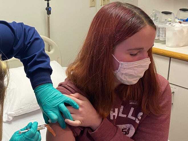A 16-year-old girl at Cincinnati Children's Hospital was the first local teenager to receive an injection as part of the hospital's clinical trial of the Pfizer COVID-19 vaccine candidate, Oct. 14, 2020