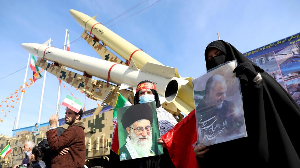 Iranian women hold pictures of the Supreme Leader Ayatollah Ali Khamenei and the late Iranian Major-General Qassem Soleimani, during the celebration of the 42nd anniversary of the Islamic Revolution in Tehran (Photo: AP) Iranian women hold pictures of the Supreme Leader Ayatollah Ali Khamenei and the late Iranian Major-General Qassem Soleimani, during the celebration of the 42nd anniversary of the Islamic Revolution in Tehran