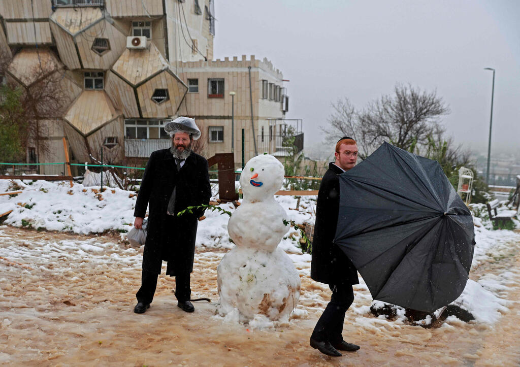 שלג בירושלים (צילום: AFP) שלג בירושלים