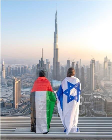 GIrls draped in flags of Israel and the UAE in Dubai (Photo: Courtesy) GIrls draped in flags of Israel and the UAE in Dubai