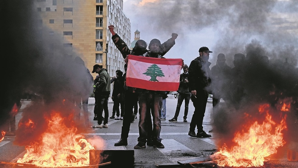 Lebanese protesters take to the streets of Beirut to demonstrate against the cost of living, March 2021 
