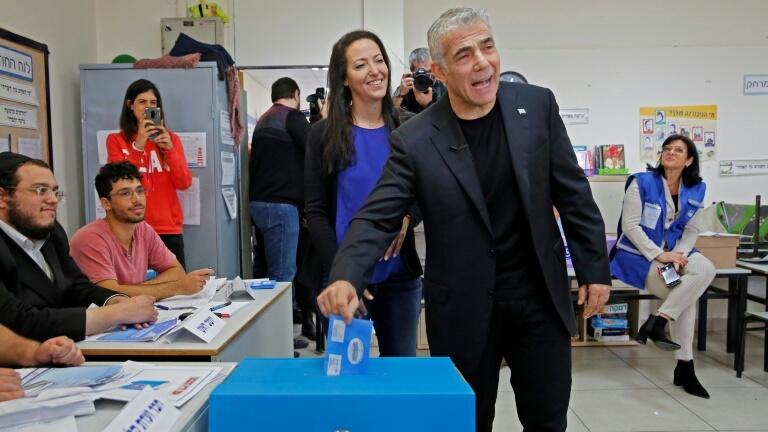 Lapid and his wife Lihi voted at a polling station in Tel Aviv during parliamentary elections in March last year 