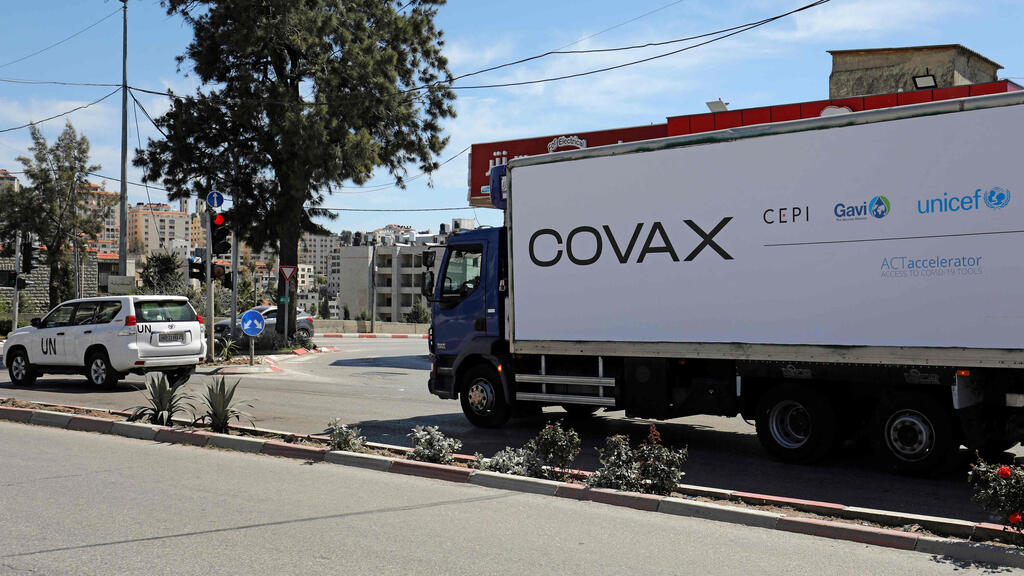 A refrigerated truck loaded with the first delivery of coronavirus vaccine via the United Nations Covax program supporting poorer areas, drives toward the West Bank city of Ramallah, on March 17, 2021 (Photo: AFP) A refrigerated truck loaded with the first delivery of coronavirus vaccine via the United Nations Covax program supporting poorer areas, drives toward the West Bank city of Ramallah, on March 17, 2021