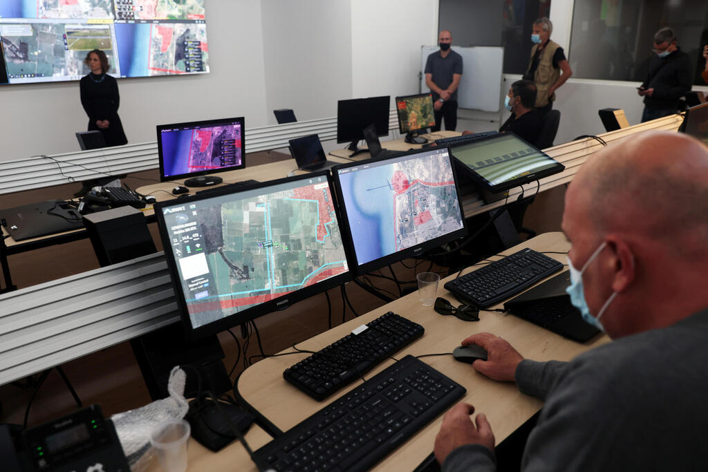 A man works on a computer at an autonomous control centre during a demonstration whereby delivery drones from various companies flew in a joint airspace near Hadera and were managed by the centre in Haifa 
