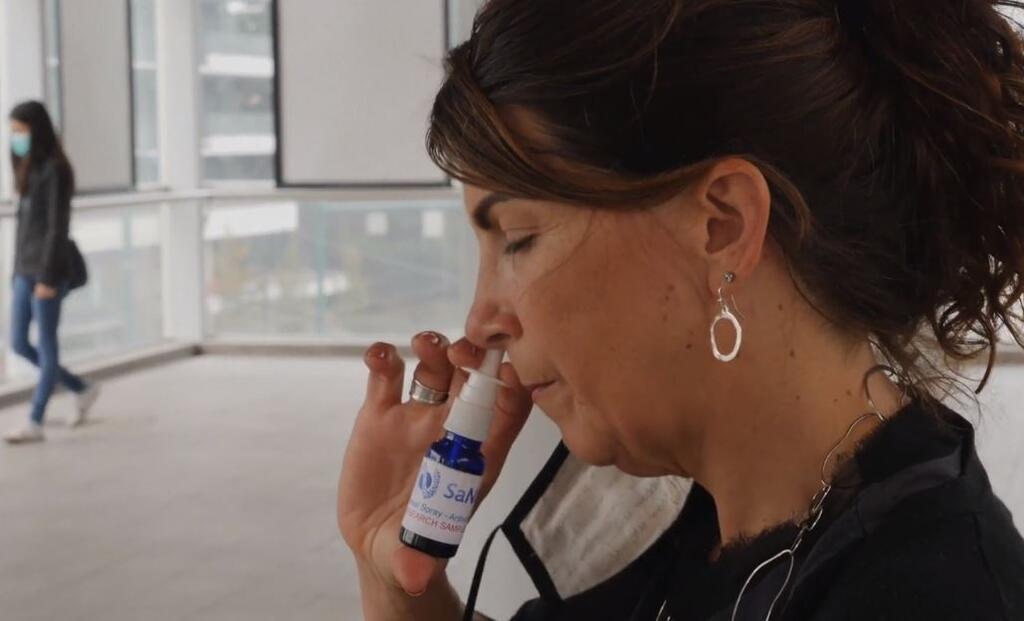 SaNOtize CEO Dr. Gilly Regev displays the company's nasal spray treatment for COVID-19   