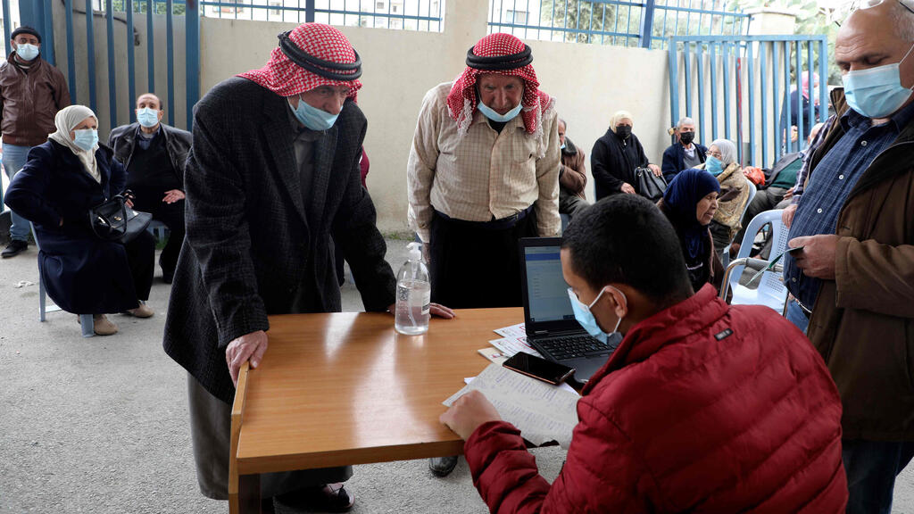 Palestinians register to get their shot of the Covid-19 coronavirus vaccine in the West Bank city of Nablus (Photo: AFP) Palestinians register to get their shot of the Covid-19 coronavirus vaccine in the West Bank city of Nablus