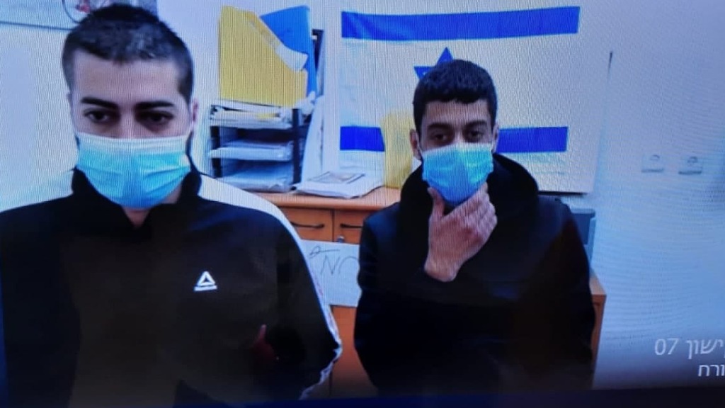 Two of the five suspects in the gang rape case of a mentally disabled teenager in court where they were charged with the crime (Photo: Avihu Shapira) שניים מהחשודים