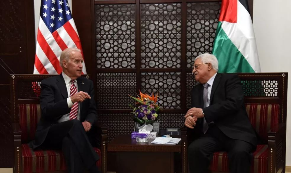 US Vice President Joe Biden (R) and Palestinian president Mahmud Abbas talk during a meeting at the presidential compound in the city of Ramallah, in the West Bank