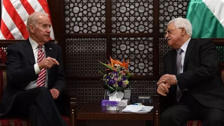 US Vice President Joe Biden (R) and Palestinian president Mahmud Abbas talk during a meeting at the presidential compound in the city of Ramallah, in the West Bank